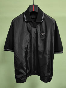 PRADA PIQUE POLO SHIRT WITH RE-NYLON DETAIL - A004