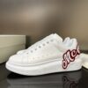 ALEXANDER MCQUEEN OVERSIZED LOGO-PATCH SNEAKERS - M057