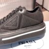 PRADA MACRO RE-NYLON AND BRUSHED LEATHER SNEAKERS - P070