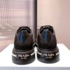 PRADA MACRO RE-NYLON AND BRUSHED LEATHER SNEAKERS - P070