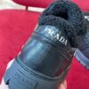 PRADA BLACK LEATHER AND SHEARLING SNEAKERS - P060