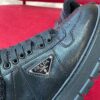 PRADA BLACK LEATHER AND SHEARLING SNEAKERS - P060