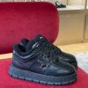 PRADA BLACK LEATHER AND SHEARLING SNEAKERS - P060