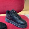 PRADA BLACK LEATHER AND SHEARLING SNEAKERS - P060